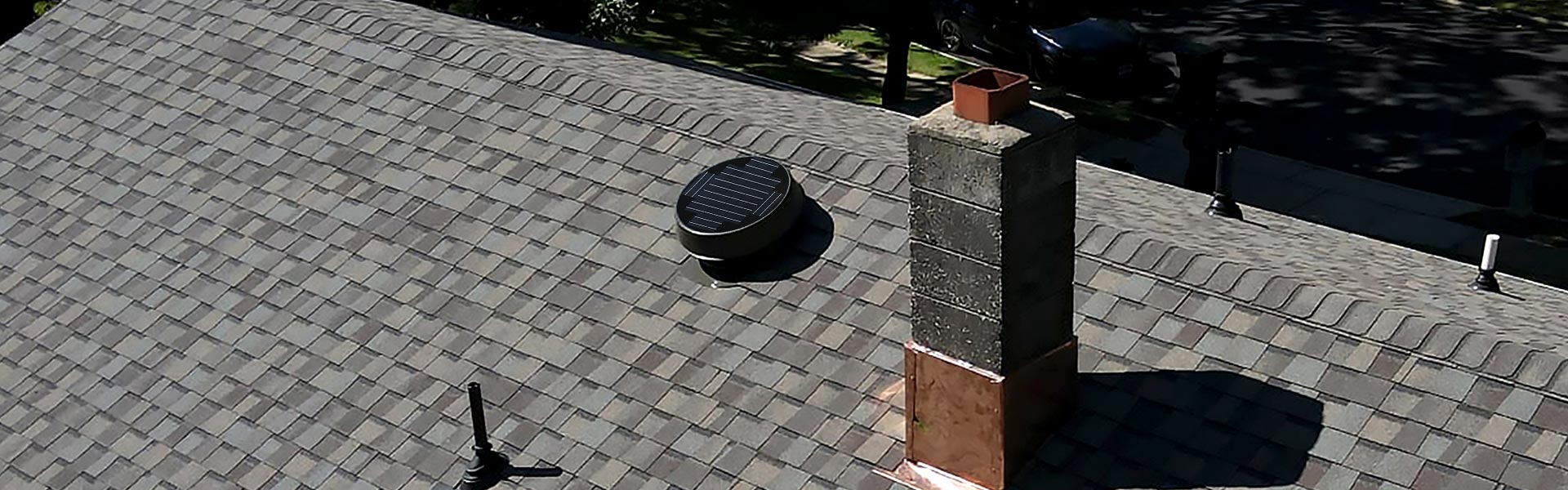 Natural Light Low Profile Solar Attic Fan shot from drone