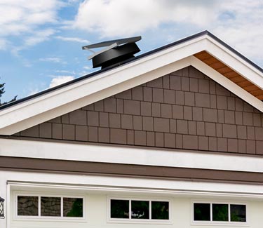 Natural Light solar attic fan installed on garage thumb